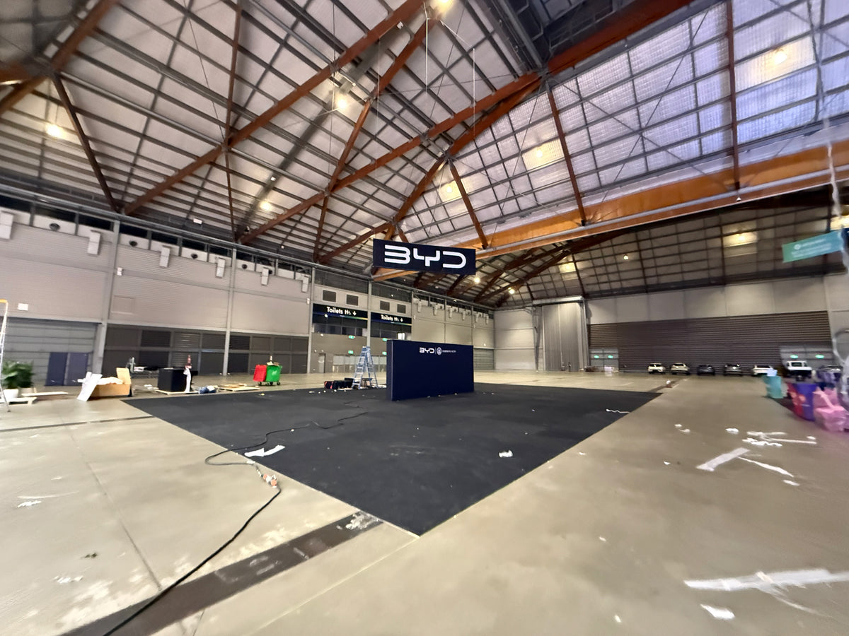 BYD at Everything Electric 2026: a central brand presence for a large vehicle display — BYD — Build-stage photograph from the venue.