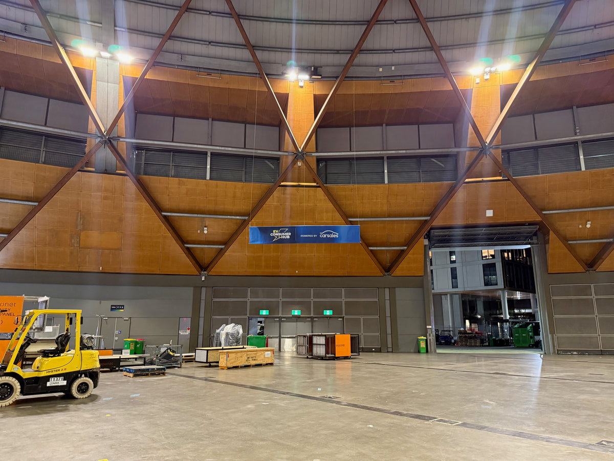 EV Consumer Hub at Everything Electric 2026: a clear identity for an EV education space — EV Consumer Hub — Build-stage photograph from the venue.