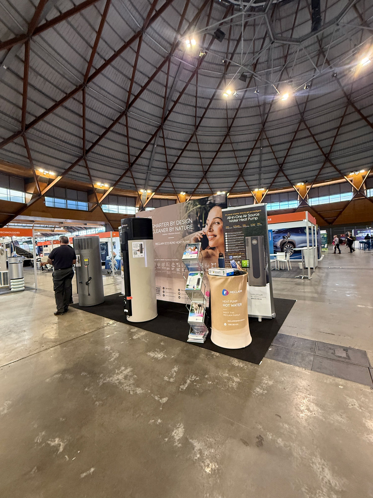 Reclaim Energy at Everything Electric 2026: two product stories on one double-sided display — Reclaim Energy — Delivered display at Everything Electric 2026.