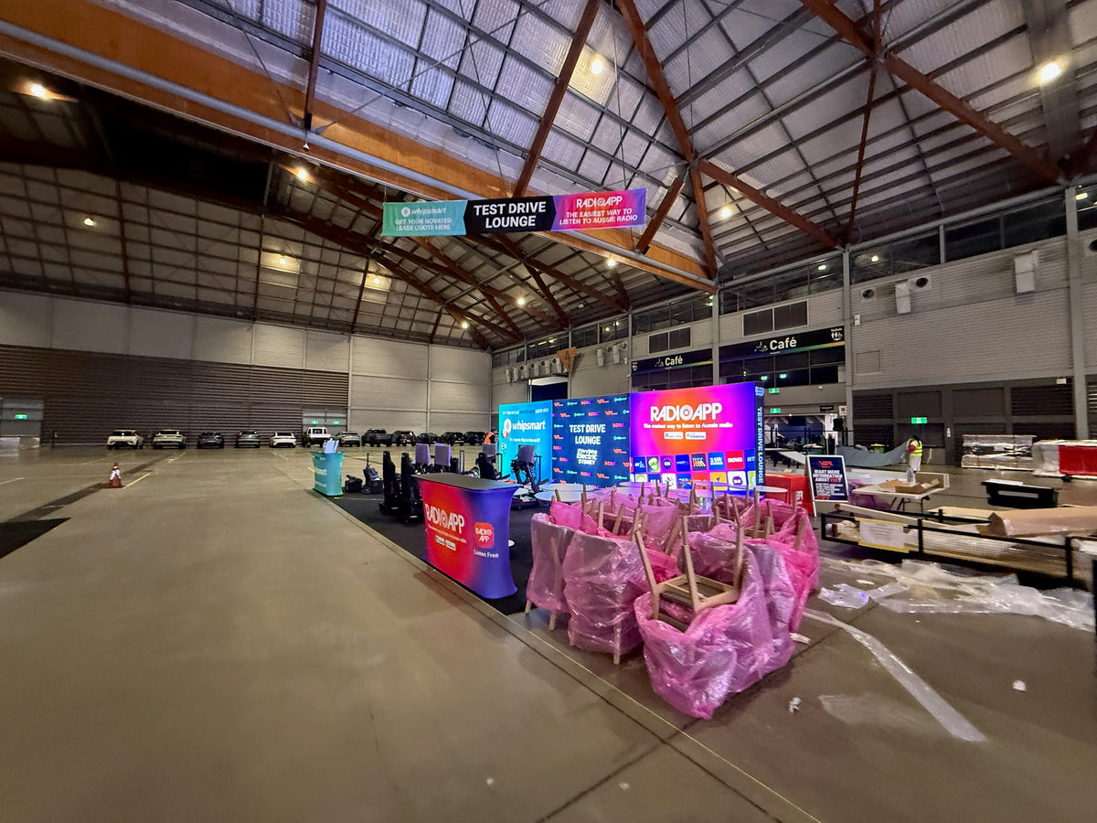 Test Drive Lounge at Everything Electric 2026: bringing three identities into one shared lounge — Test Drive Lounge — Build-stage photograph from the venue.